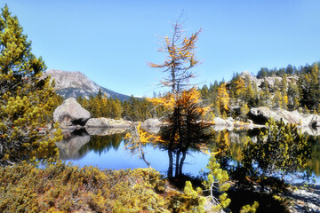 The Serva lake, a splendid alpine lake, in the natural park of Monte Avic in the Aosta valley