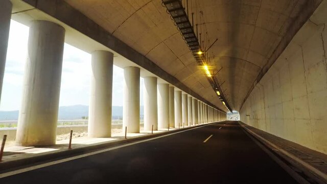 Helmet camera view of motorcycle travelling on empty highway. Peloponnese highway Moreas, summer of 2020