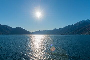 Alpine Lake Maggiore with Mountain and Sunlight in Ascona, Ticino in Switzerland.