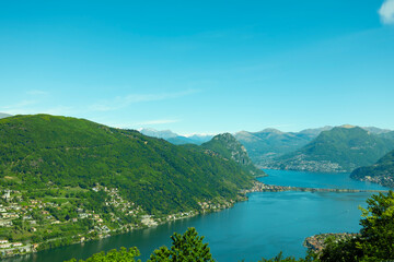 Obraz na płótnie Canvas Aerail View over Lugano with Alpine Lake and Mountain in a Sunny Day in Ticino, Switzerland.