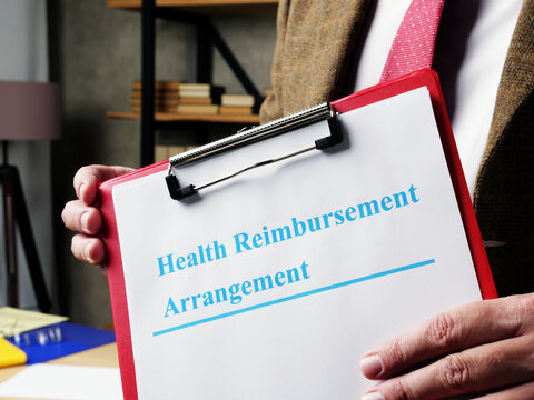 Man Proposes Health Reimbursement Arrangement HRA Documents.