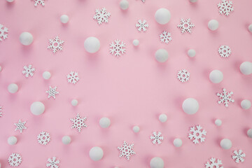 Christmas minimal concept. Snowballs and snowflakes on pink background. Composition with copy space
