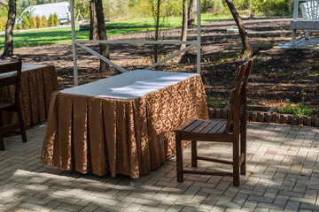 Outdoor benches for relaxation and enjoyment in contrasting light. Selective focus