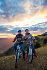 Fototapeta na wymiar Senior Couple On Cycle Ride In Countryside