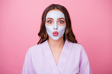 Photo portrait of funny girl with plump pouted lips doing daily skincare procedures moisturizing mask isolated on pink color background