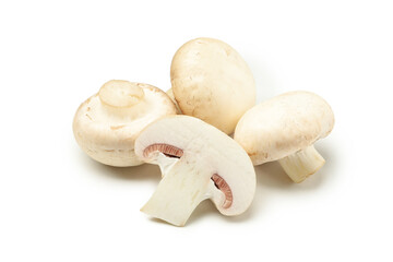 Four raw champignons isolated on white background