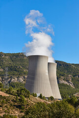 Nuclear power plant chimneys with steam. Energy industry