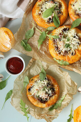 Baked bun with meat and mushrooms and decorated with herbs