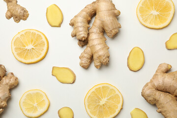 Fresh ginger and lemon on white background, top view