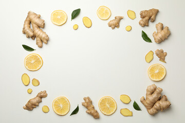 Fresh ginger and lemon on white background, top view