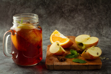 mulled wine from red wine and fruits on gray background.