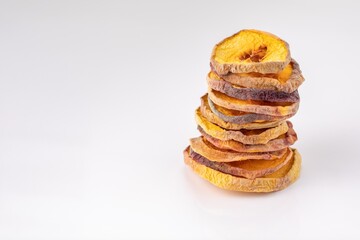 slices of dried peach on a white background. dried fruits. eco. macro.