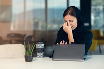 professional young female muslim worker having problem