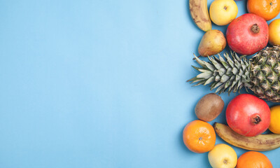 Fresh fruits on a blue background.