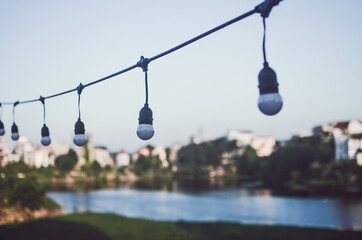 String of light bulbs hanging outside