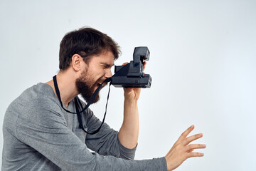 Fototapeta premium photographer with camera hobby technology studio lifestyle creative light background