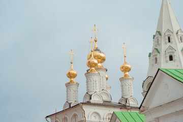 Fototapeta na wymiar Russian Church Golden domes in the blue sky