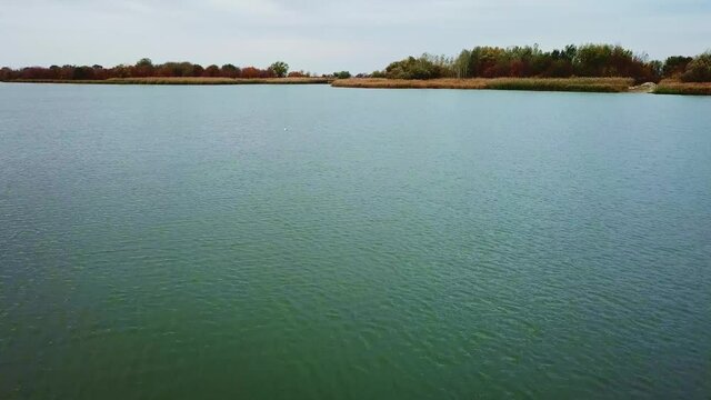 autumn landscape on the river. calm river surface, windless weather.