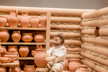 miniature figurines of people engaged in crafts