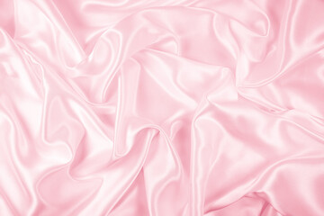 Beautiful elegant wavy light pink satin silk luxury cloth fabric texture, abstract background...