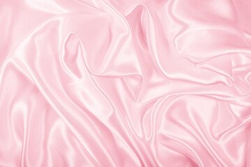 Beautiful elegant wavy light pink satin silk luxury cloth fabric texture, abstract background design. Copy space