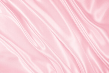 Beautiful elegant wavy light pink satin silk luxury cloth fabric texture, abstract background design. Copy space