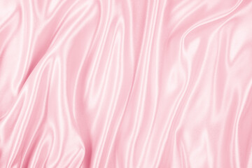 Beautiful elegant wavy light pink satin silk luxury cloth fabric texture, abstract background design. Copy space