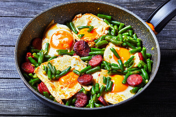 Breakfast of green beans baked eggs and chorizo