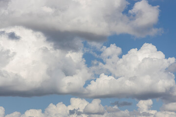 fluffy clouds and blue sky background