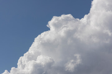 fluffy clouds and blue sky background