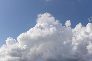 Naklejka na ściany i meble fluffy clouds and blue sky background