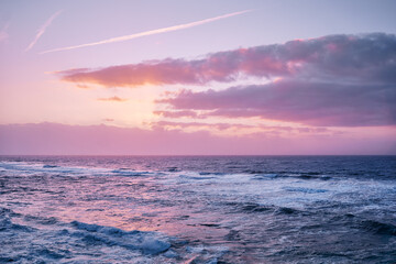 Amazing sunset on Atlantic ocean. Waves and foam.