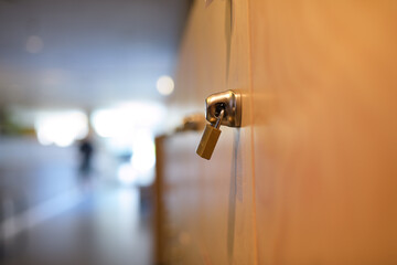 Closeup of a metal lock hanging on a door