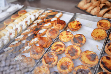 Delicious dessert and sweet in the showcase window of pastry shop.