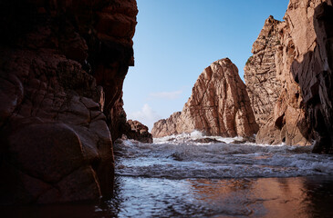 Fototapeta na wymiar Cliffs and rocks on the Atlantic ocean coast - Praia da Ursa beach, Portugal.