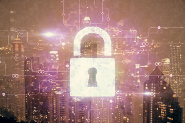 Lock icon hologram on city view with skyscrapers background multi exposure. Data security concept.