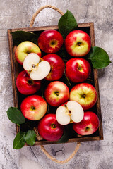 Naklejka na ściany i meble Ripe red apples in wooden box.