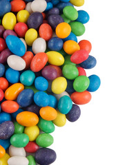 Multicolored candies isolated with space for text