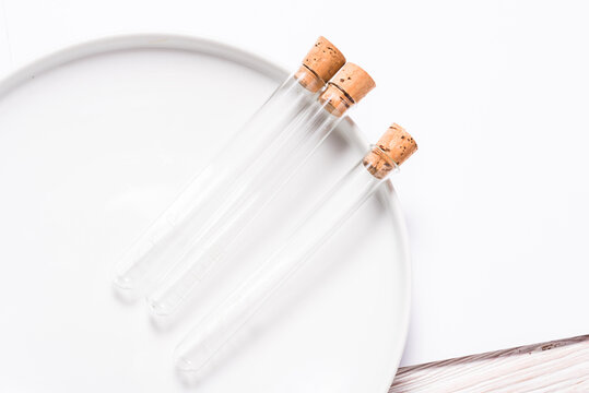 Clear glass laboratory tubes with cork stoppers