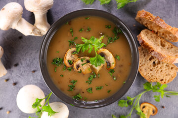 mushroom soup in bowl with bread