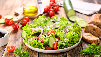 greek salad with cucumber, tomato, olive, feta cheese and onion