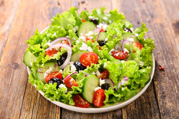 greek salad with cucumber, tomato, olive, feta cheese and onion