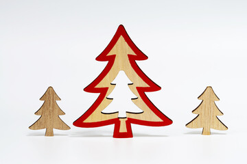 Christmas trees made of natural wood, isolated on a white background with a soft shadow. The concept of Christmas decorations.