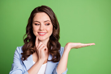 Photo of girl arm hold look empty space finger cheekbone wear blue blazer isolated green color background