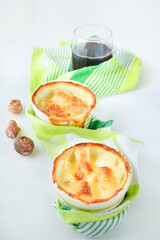 Topinambur flan with green towel on a white backgorund