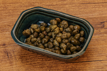 Tasty capers in the bowl