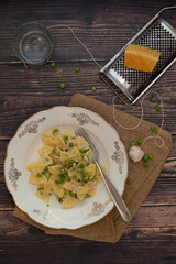 Italian pasta with cream, pea beans and ham