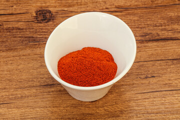 Dry paprika powder in the bowl