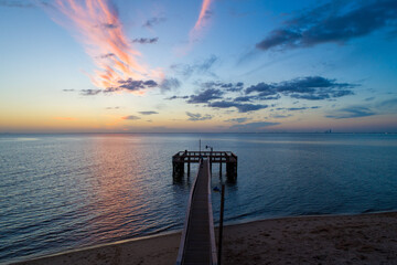 sunset on the pier at mobile bay 