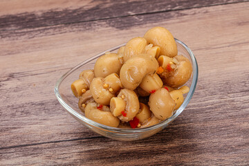 Pickled champignons in the bowl
